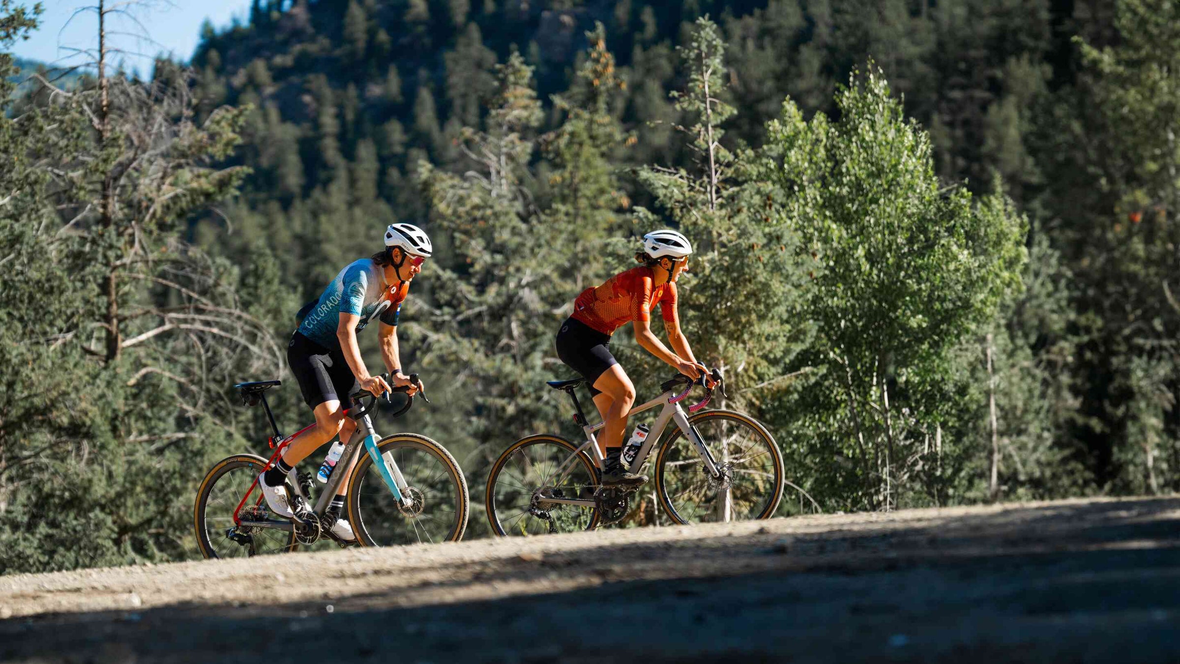 Cyclists Riding up a Mountain in a Colorado Jersey and Cargo Jersey