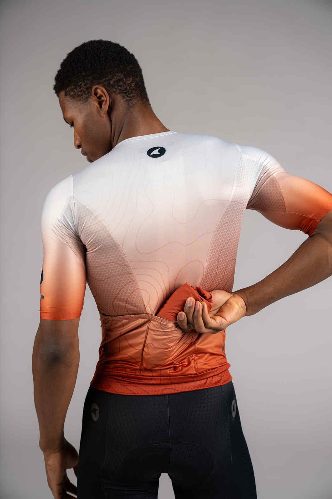 Men's Burnt Orange Packable Cycling Wind Vest - Rolled Up