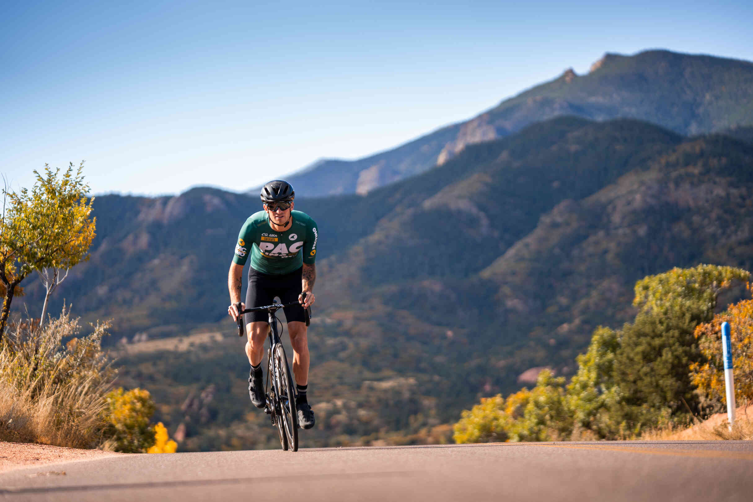 Cycling Riding in Garden of the Gods in a Green Cycling Jersey
