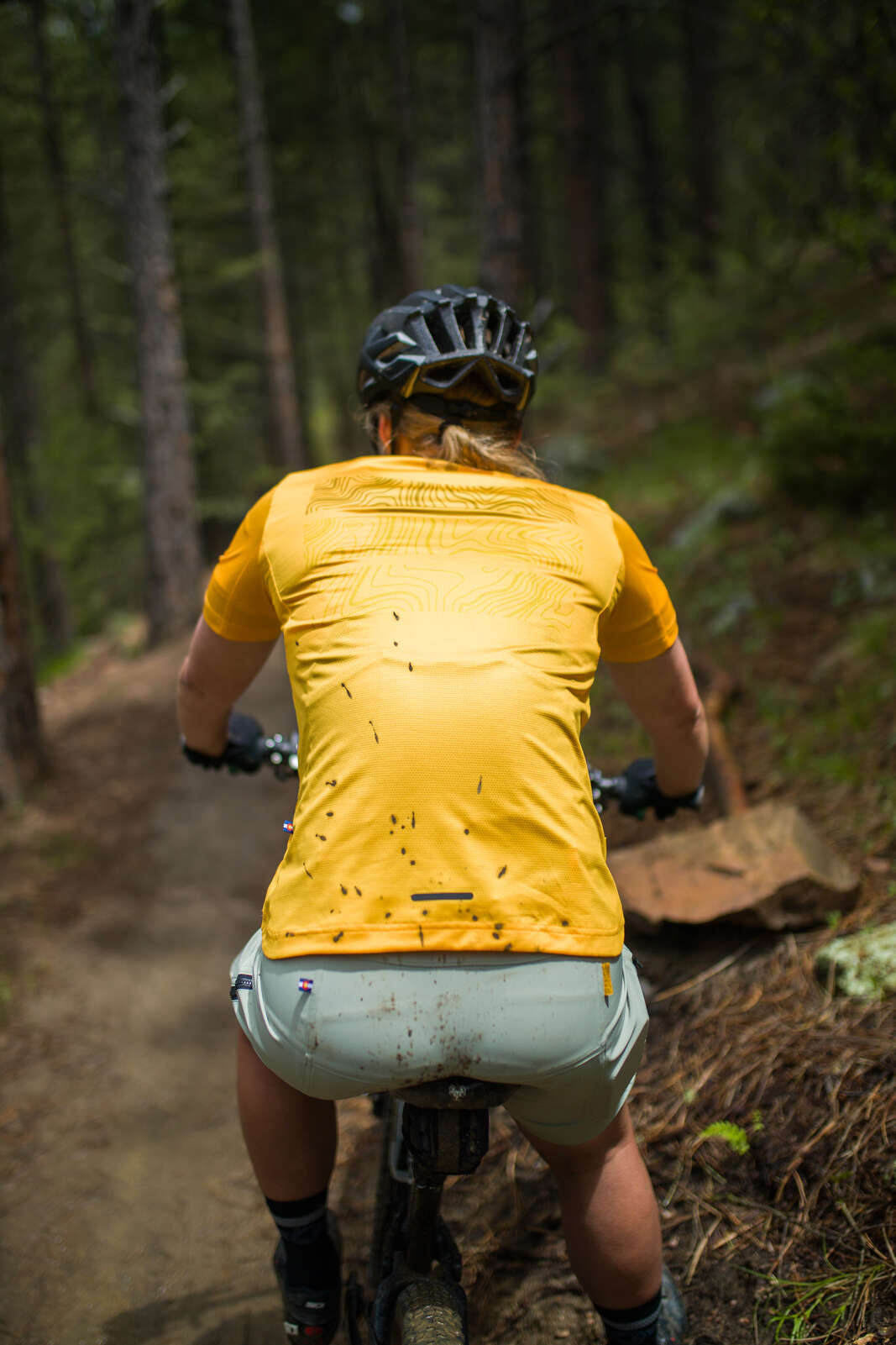 Women's Orange Mountain Bike Jerseys - Back View on Trail