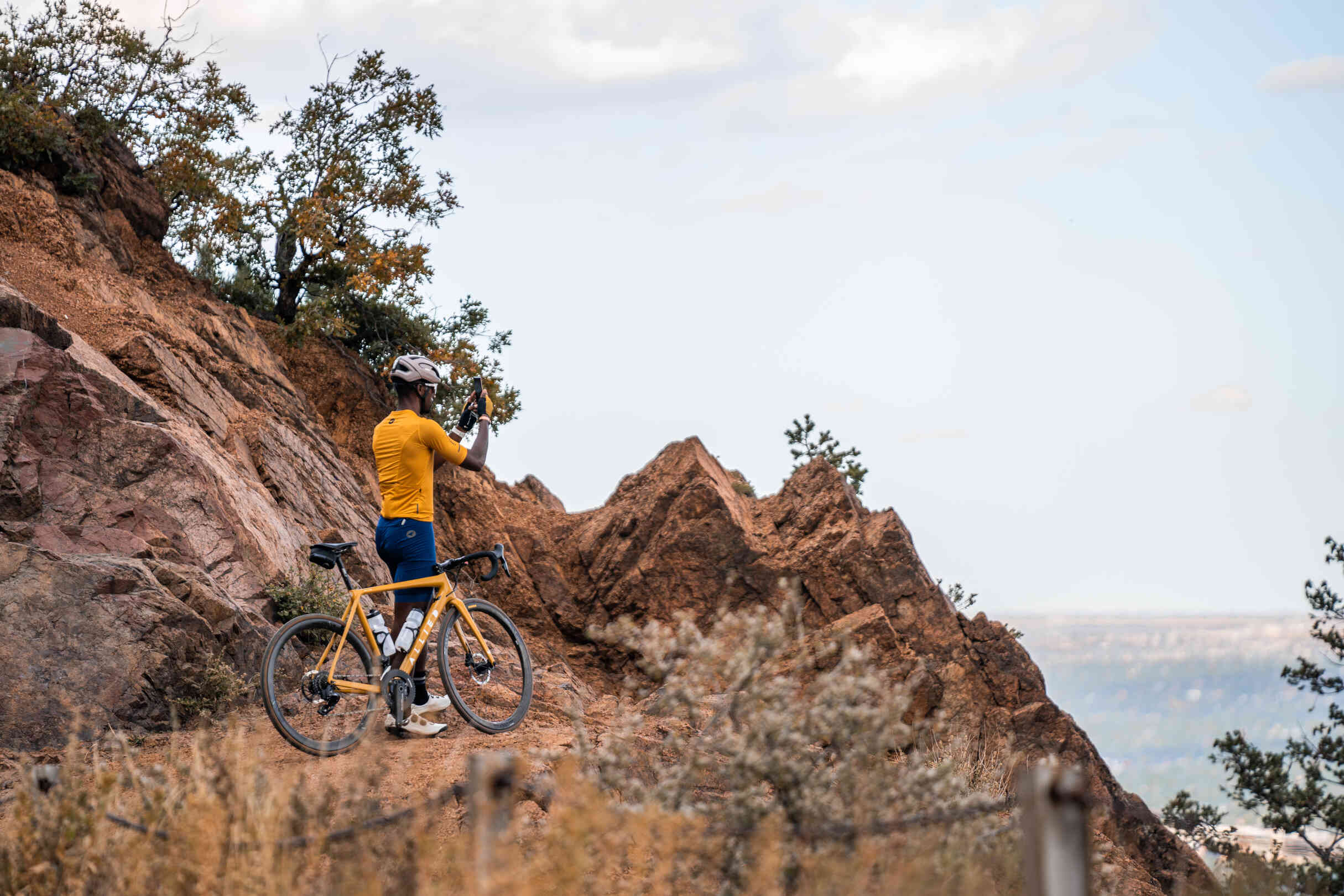 Cyclist at Garden of the Gods in a Goldenrod Cycling Kit