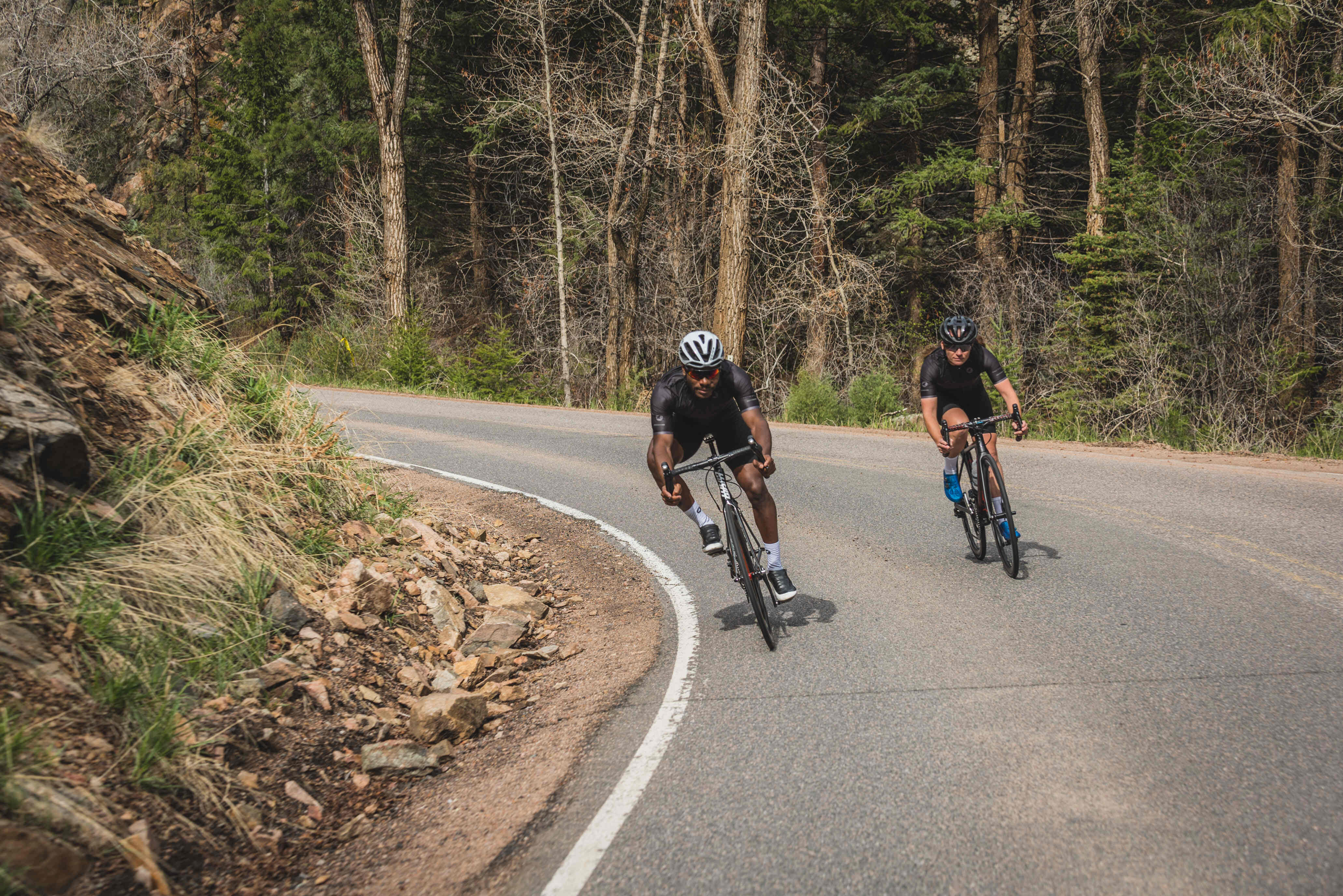 Cyclists Descending down a Mountain