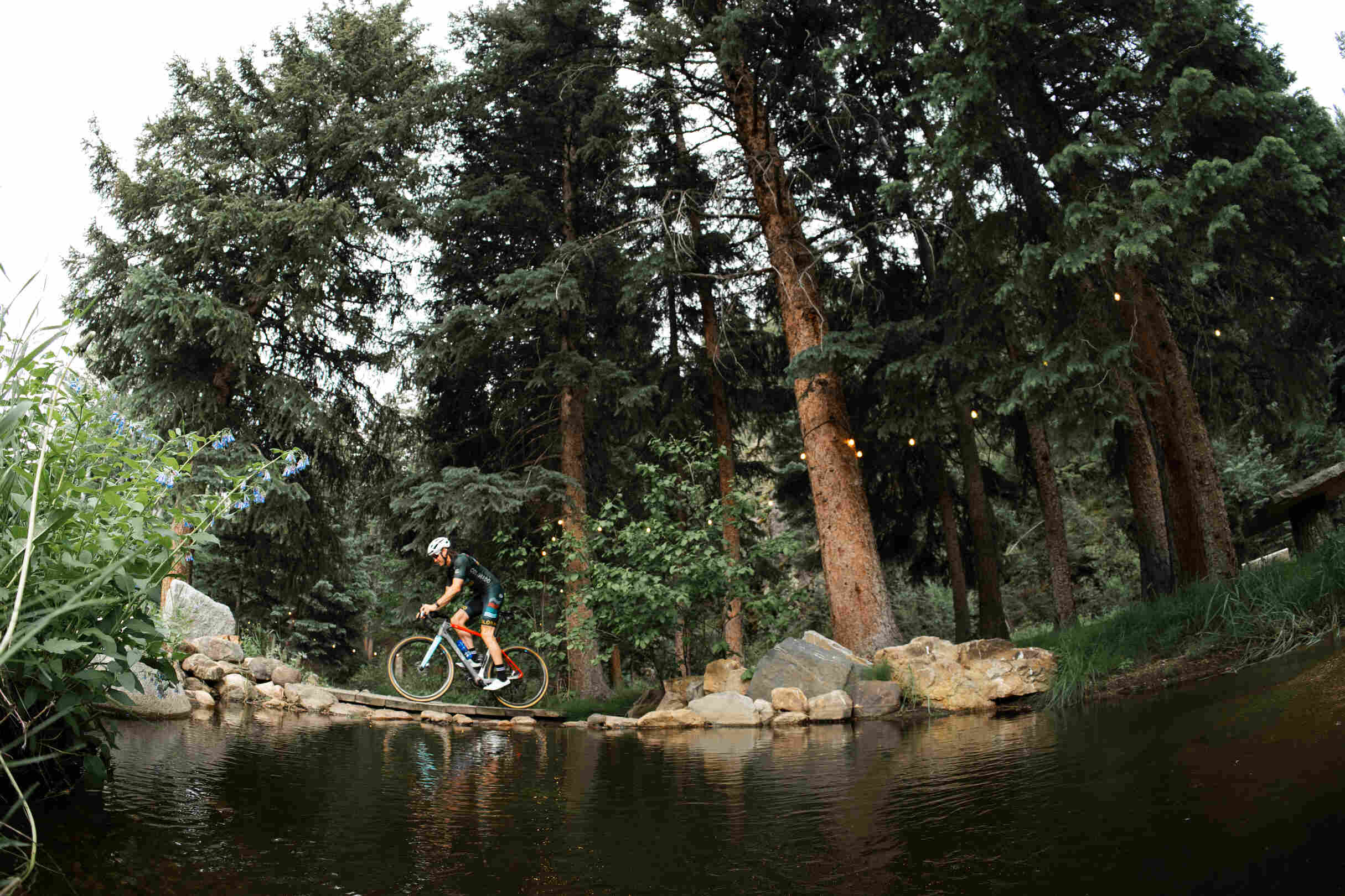 Grant Koontz Riding Across a Bridge