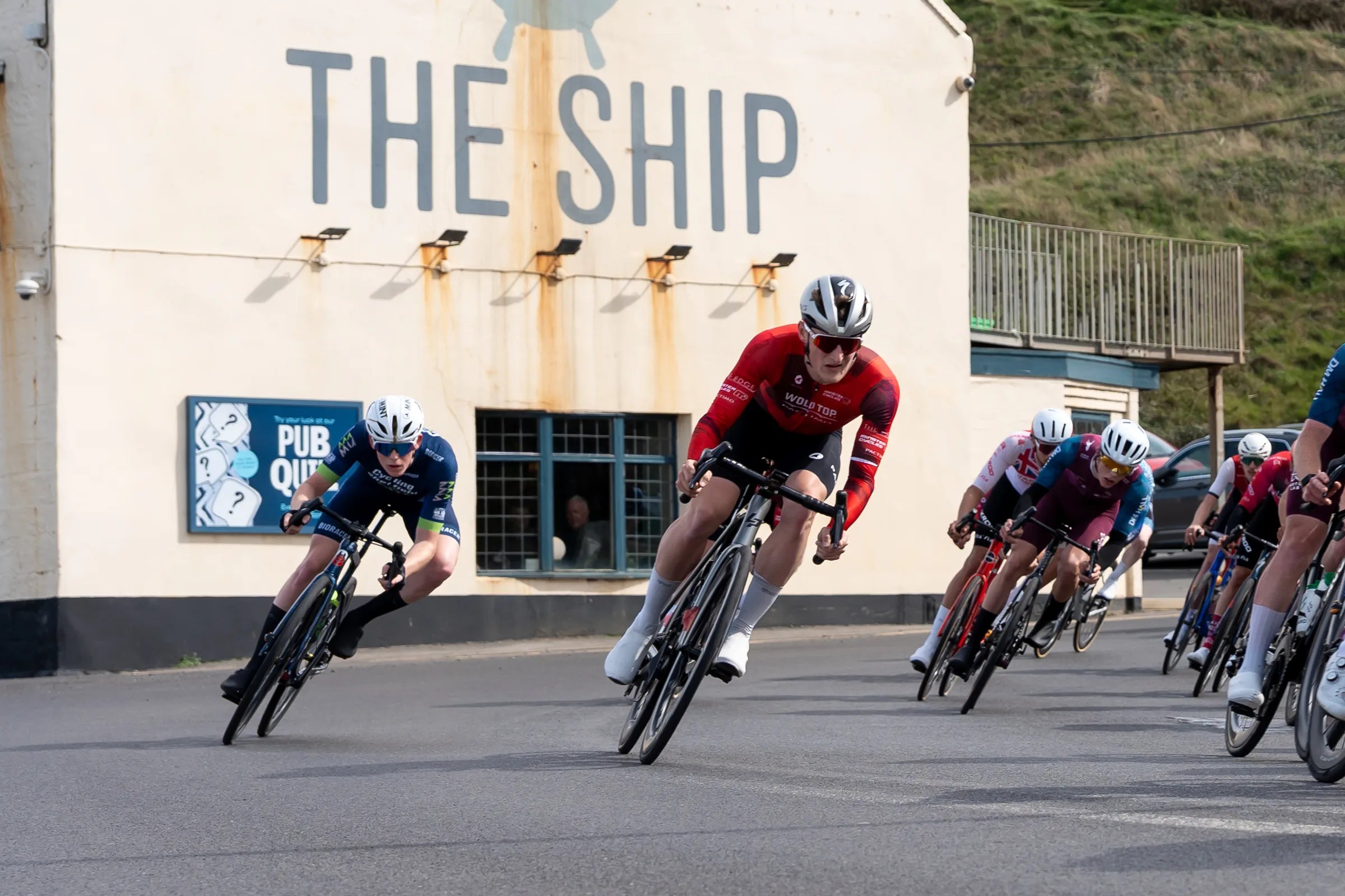 cyclists racing a criterium and going around a corner