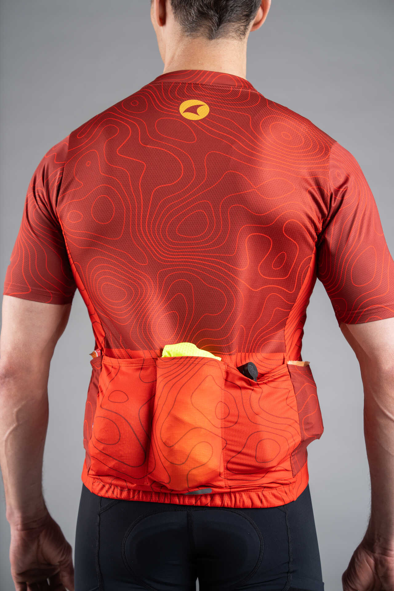 Men's Red Cargo Cycling Jersey in Teal Topo Design - Back View