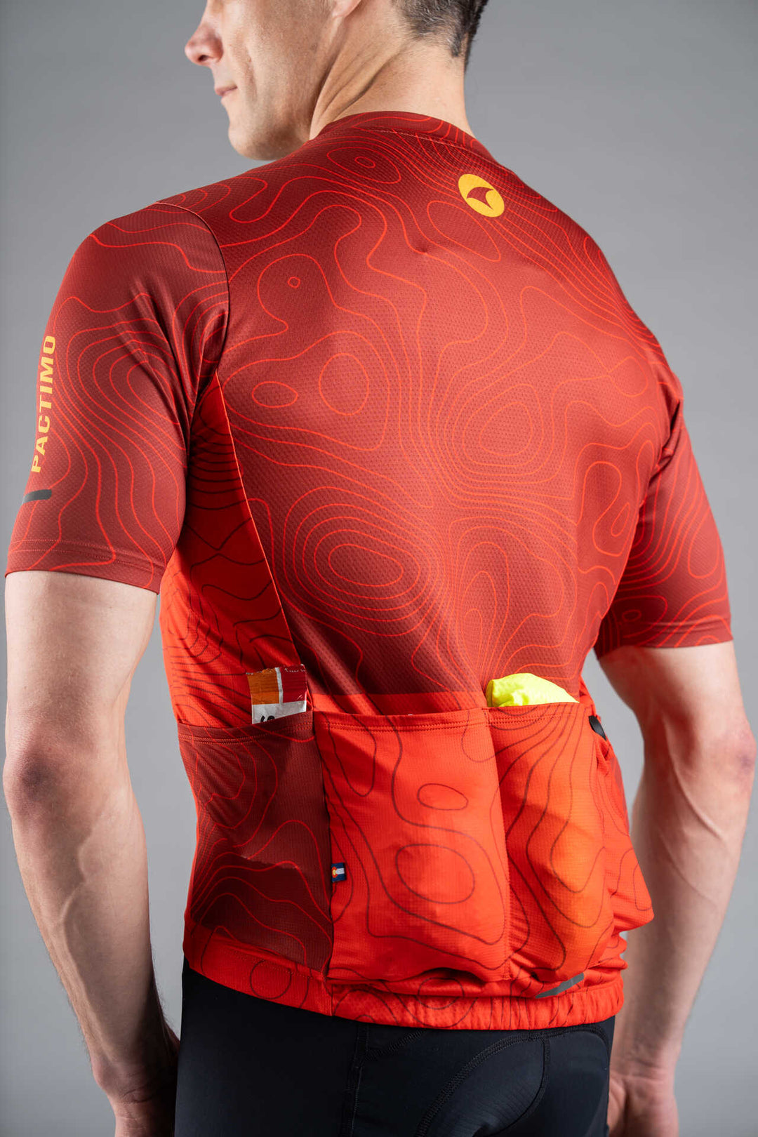 Men's Red Cargo Cycling Jersey in Teal Topo Design - Back Pockets Filled