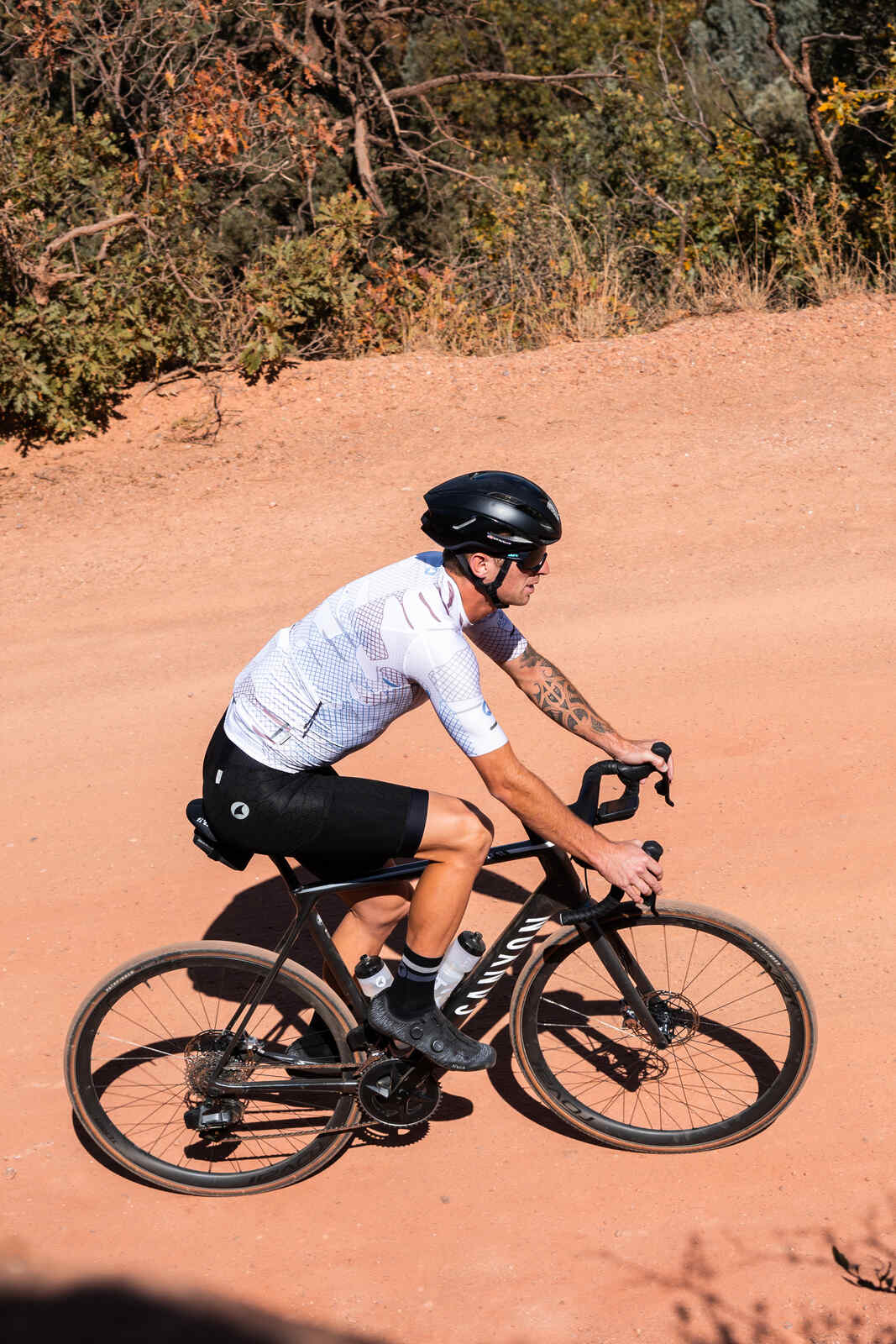 Cyclist in a Men's White Gravel Cycling Jersey 