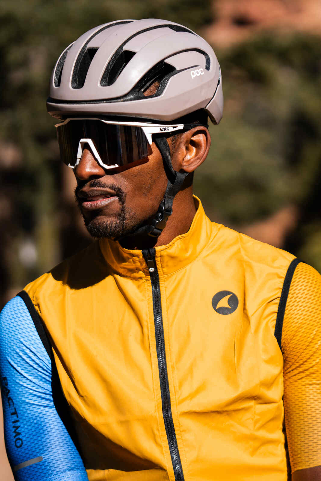 Cyclist in a Golden Yellow Men's Cycling Wind Vest
