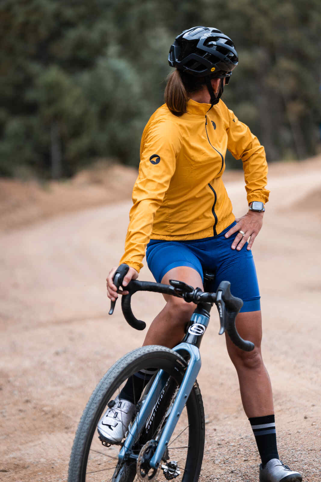 Cyclist in Women's Yellow Packable Cycling Wind Jacket