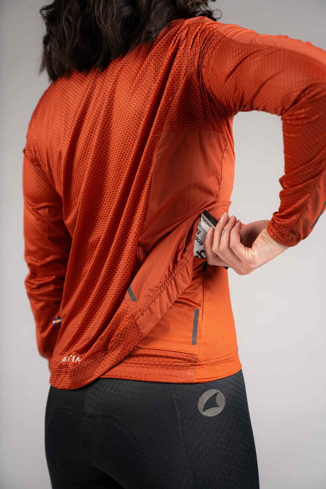 Women's Burnt Orange Packable Cycling Wind Jacket - Jersey Pocket Access