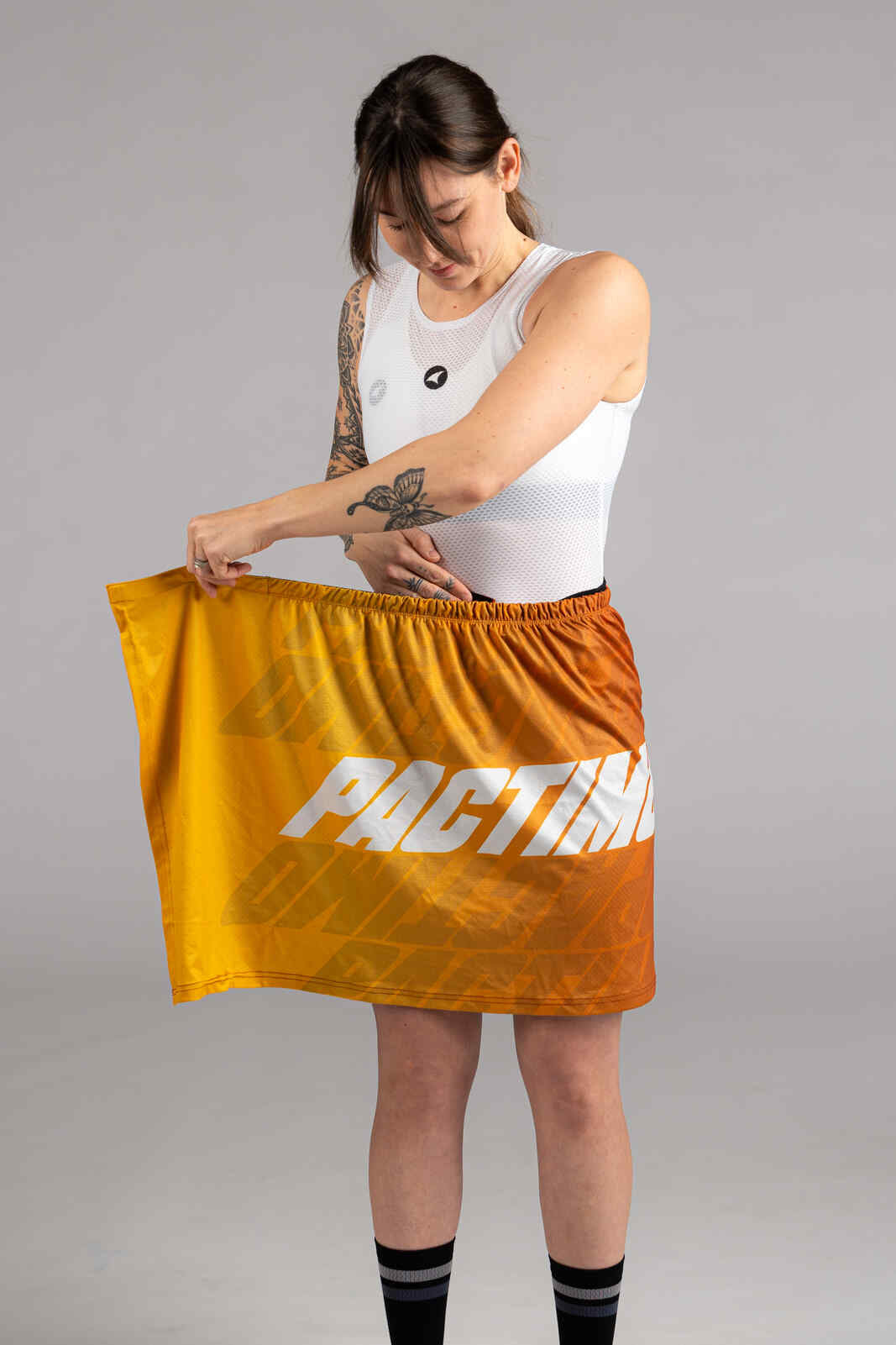 Cyclist putting on a Yellow Quick Release Cycling Changing Kilt