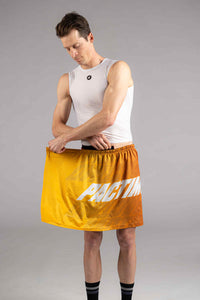 Cyclist putting on a Quick Release Cycling Changing Kilt in yellow