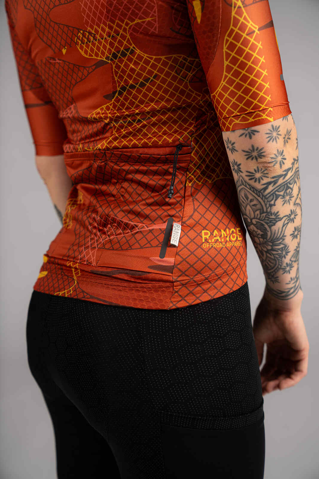 Women's Burnt Orange Gravel Cycling Jersey - Back Pocket Zipper Pull