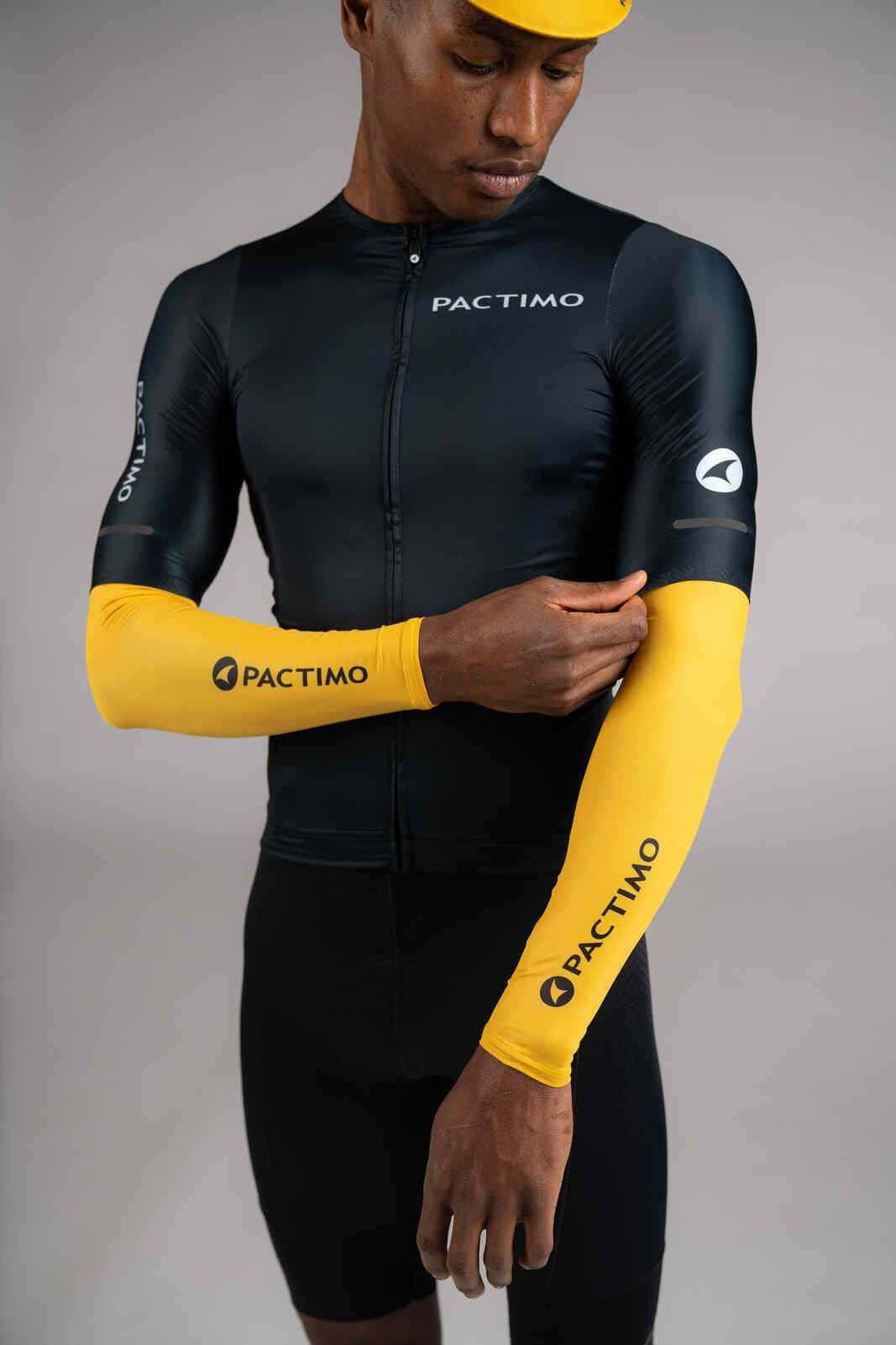 Yellow Cycling Sun Sleeves under Navy Blue Jersey