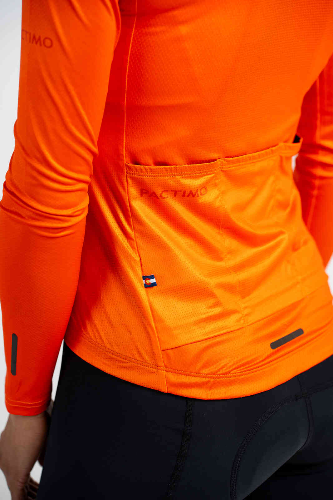 Women's Red/Orange Aero Long Sleeve Cycling Jersey - Back Pockets Close-Up