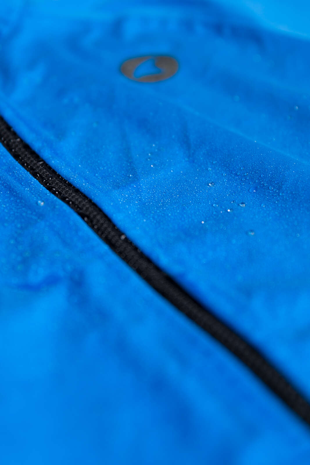 Women's Blue Waterproof Cycling Rain Jacket - Shown Wet