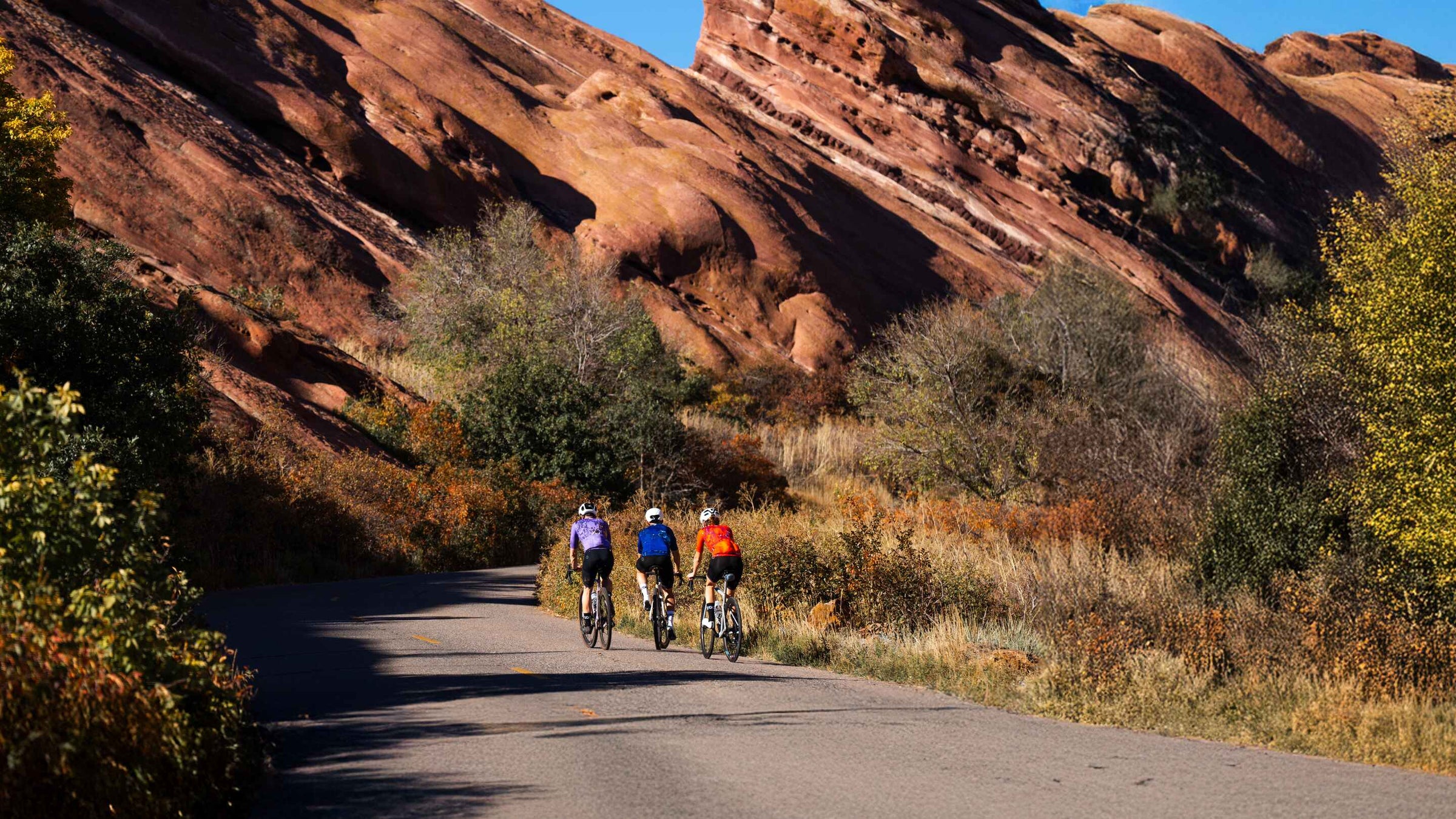 Pactimo Summer Cycling Lookbook - cyclist on road near Red Rocks, Morrison Colorado