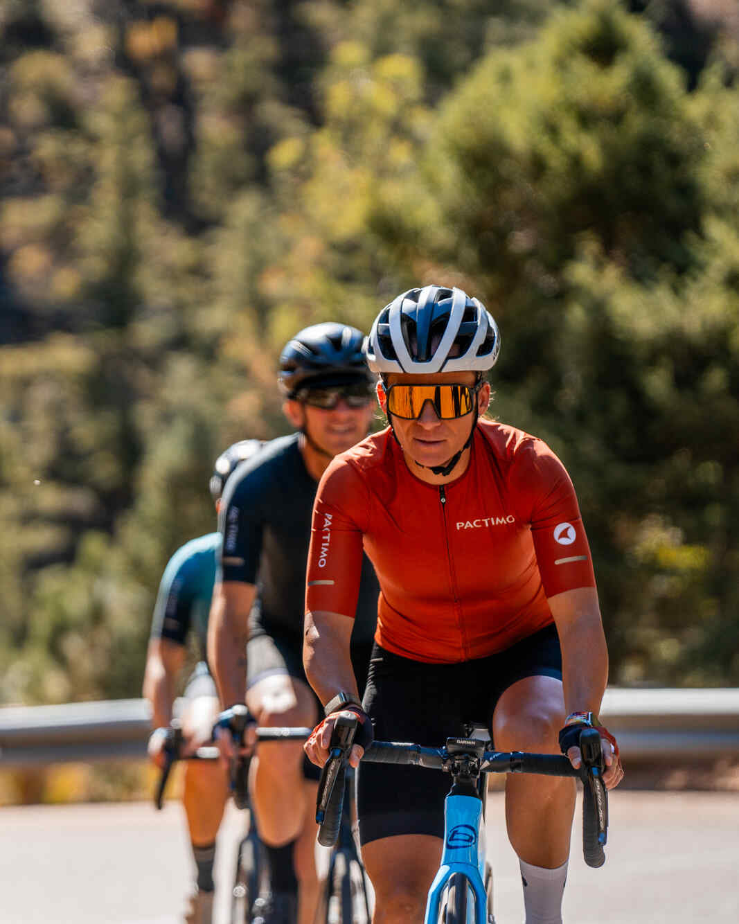 Cyclist Wearing a Women's Burnt Orange Summit Aero Cycling Jersey