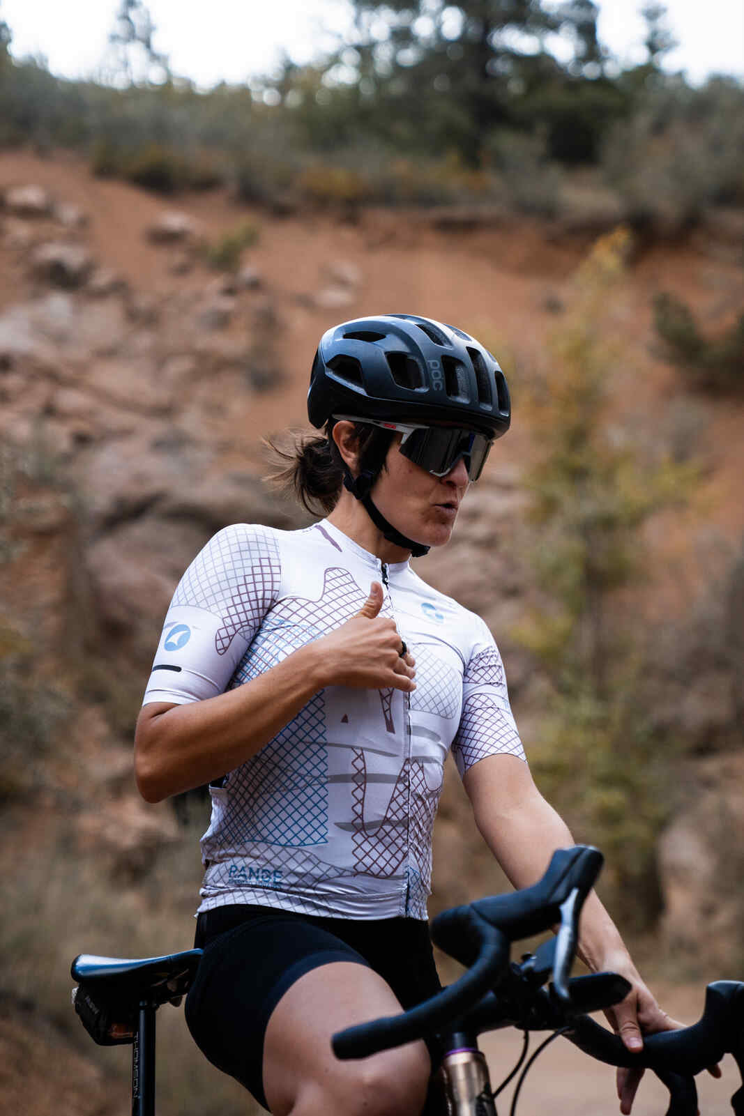Cyclist in Women's White Gravel Cycling Jersey
