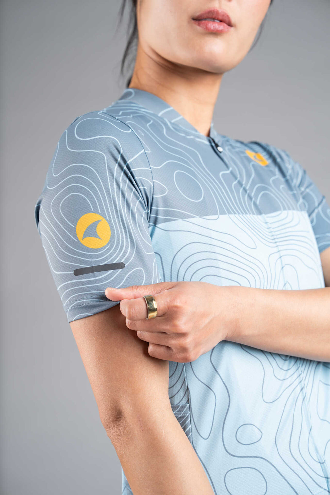 Women's Light Blue Ascent Cargo Cycling Jersey - Front Close-Up and Sleeve