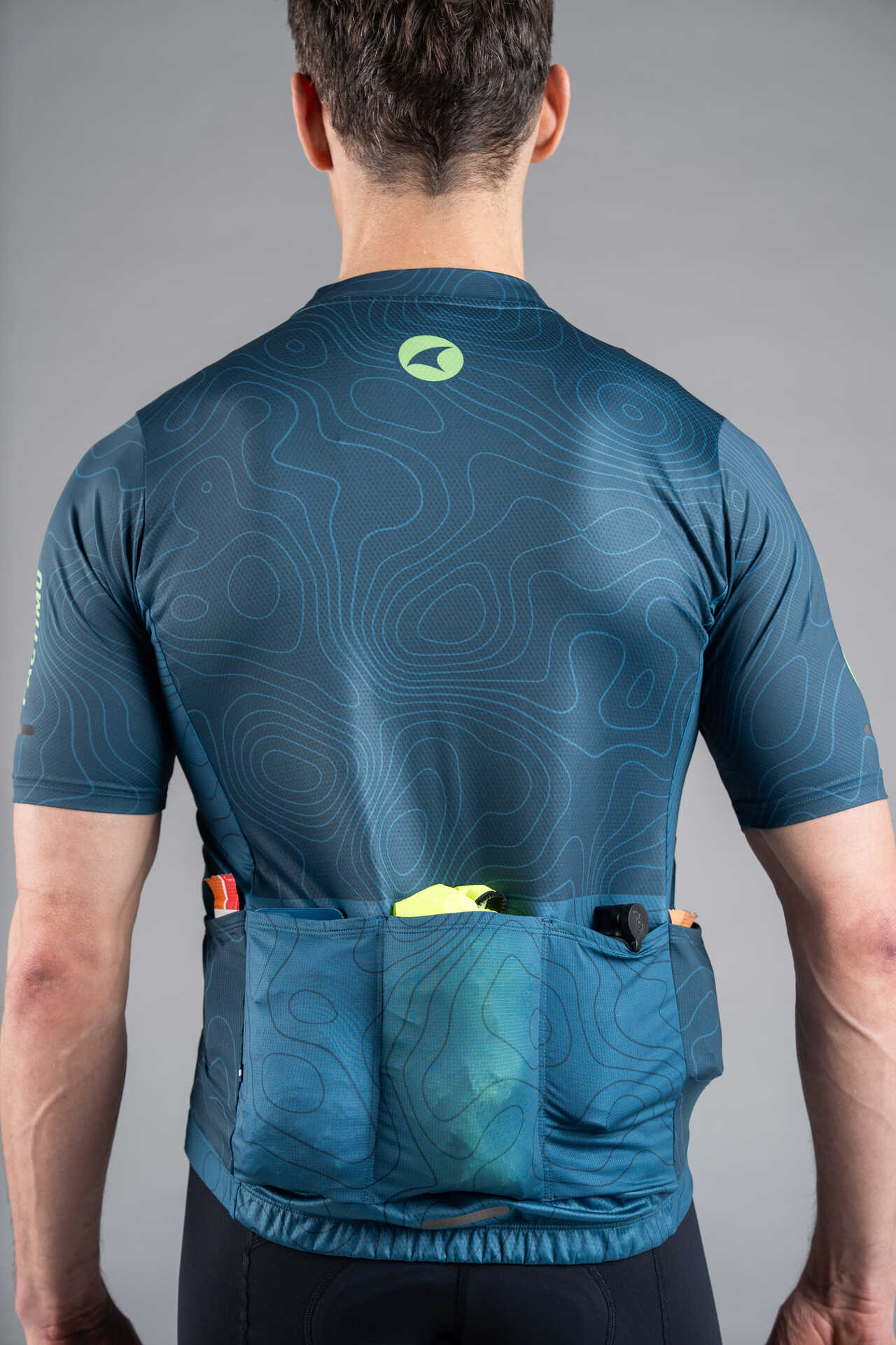Men's Teal Cargo Cycling Jersey in Teal Topo Design - Back View Pockets Full
