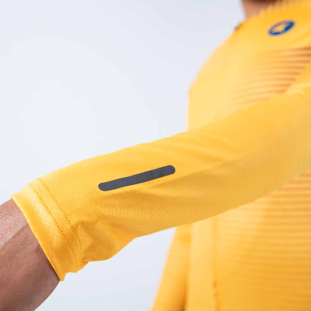 Women's Long Sleeve Cycling Jersey Convergence Design - Sleeve Reflector Detail #color_mango