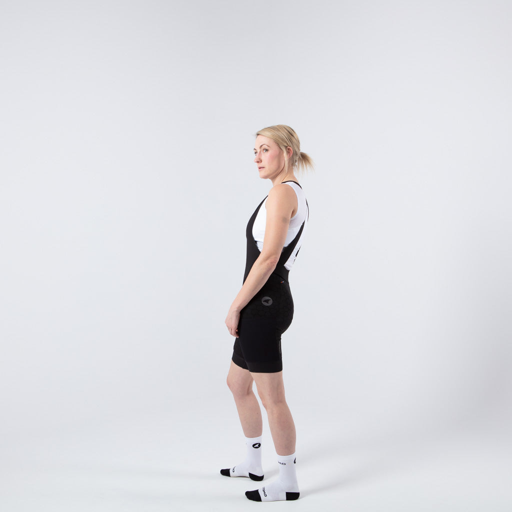 Women's Long Distance Cargo Bib Shorts - on body Side View #color_black