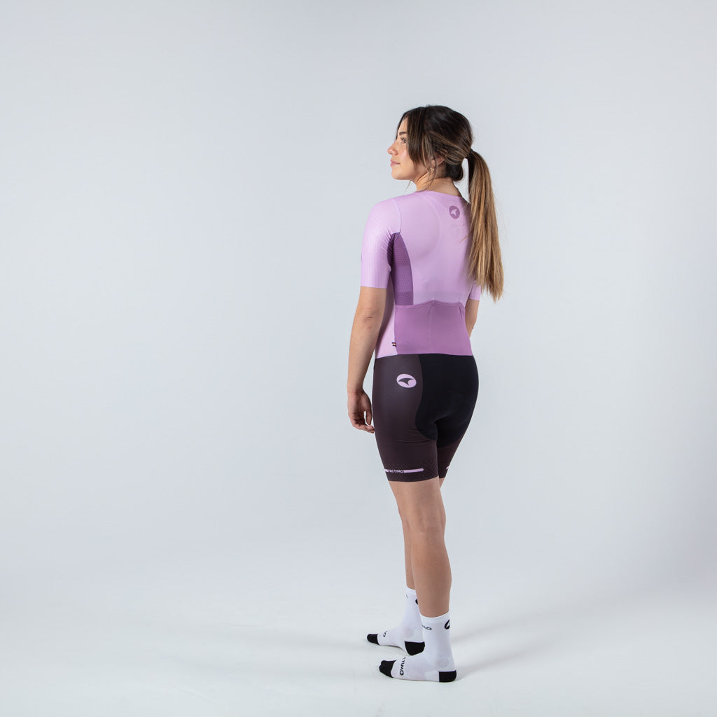 Women's Lightweight Cycling Skinsuit - on body Left Back View #color_lilac