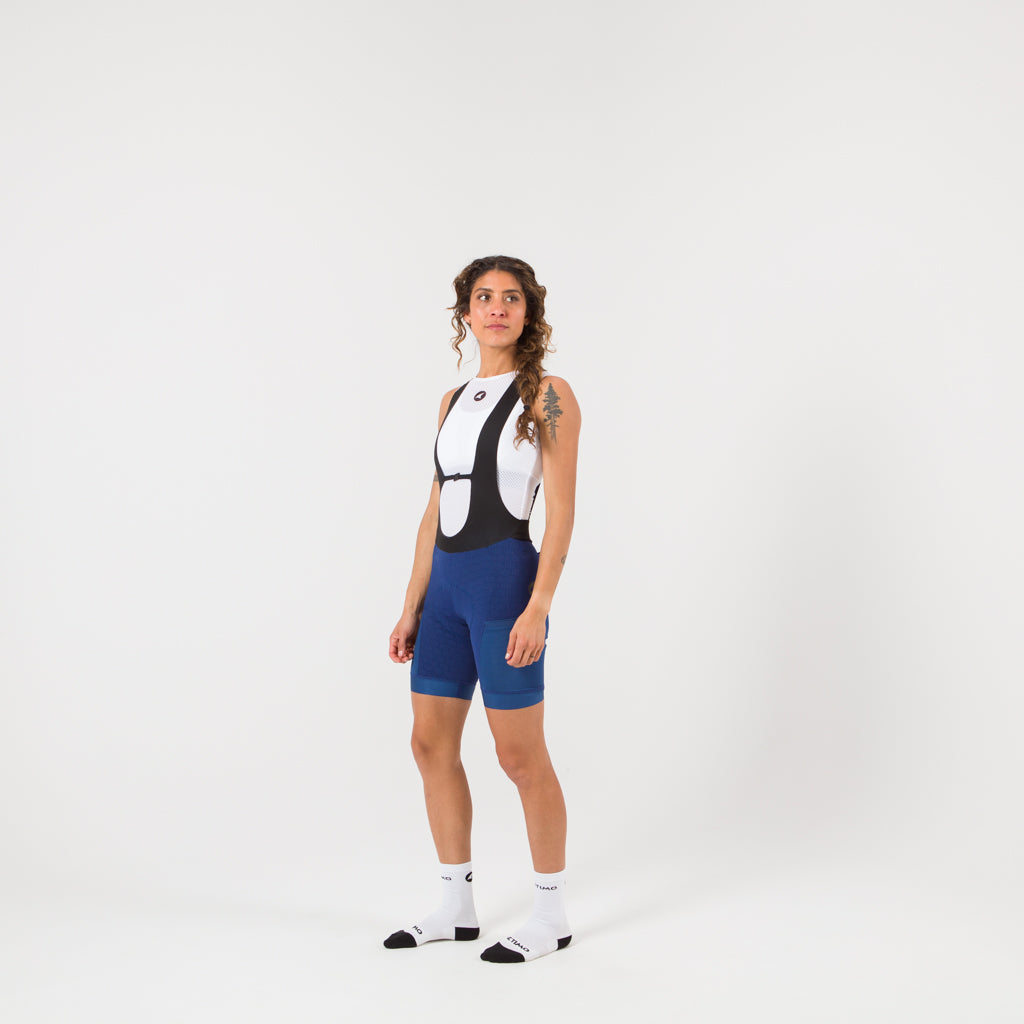 Women's Blue Long Distance Cargo Bib Shorts - on body Front View #color_navy